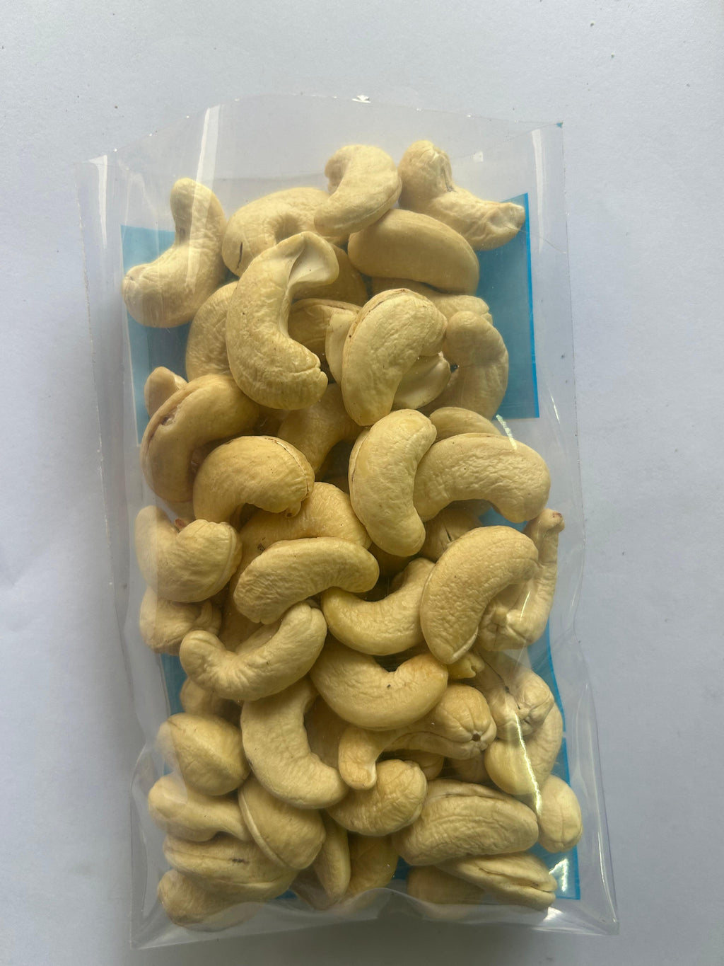 Packaged cashews on a white background