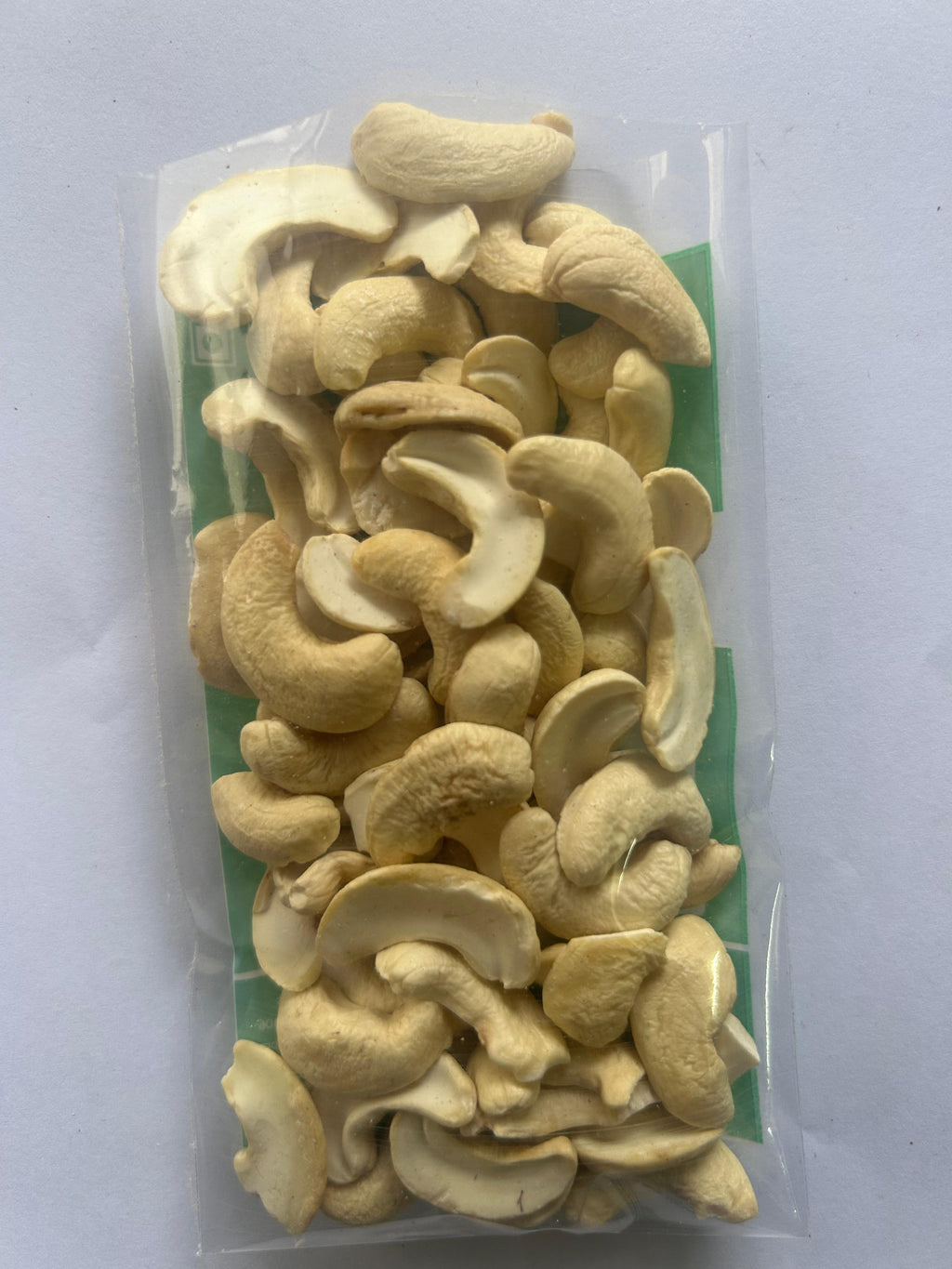Packaged 2 piece cashews on a white background