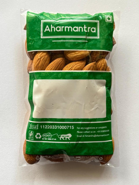 Bag of almonds with Aharmantra branding on a white background